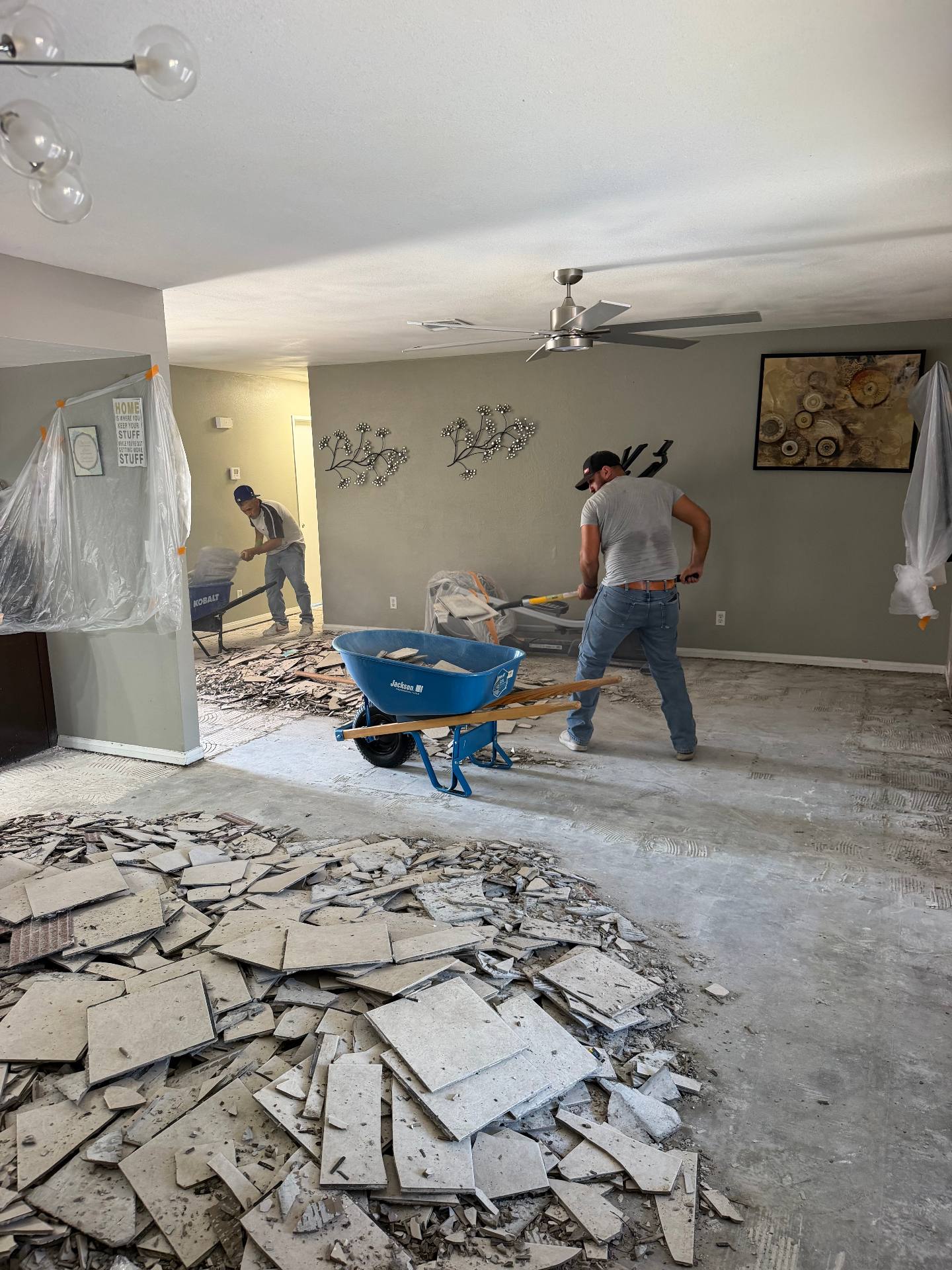 Interior tile demolition in progress by the HG team